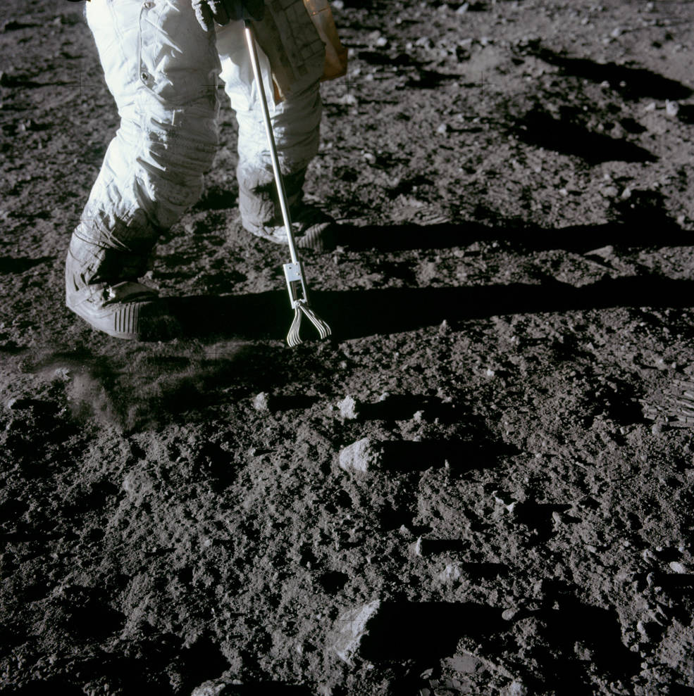 apollo_12_eva1_conrad_collecting_sample_w_tongs