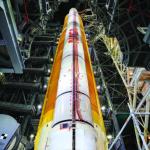 Artemis I boosters and core stage in the Vehicle Assembly Building at Kennedy Space Center in Florida (side view).