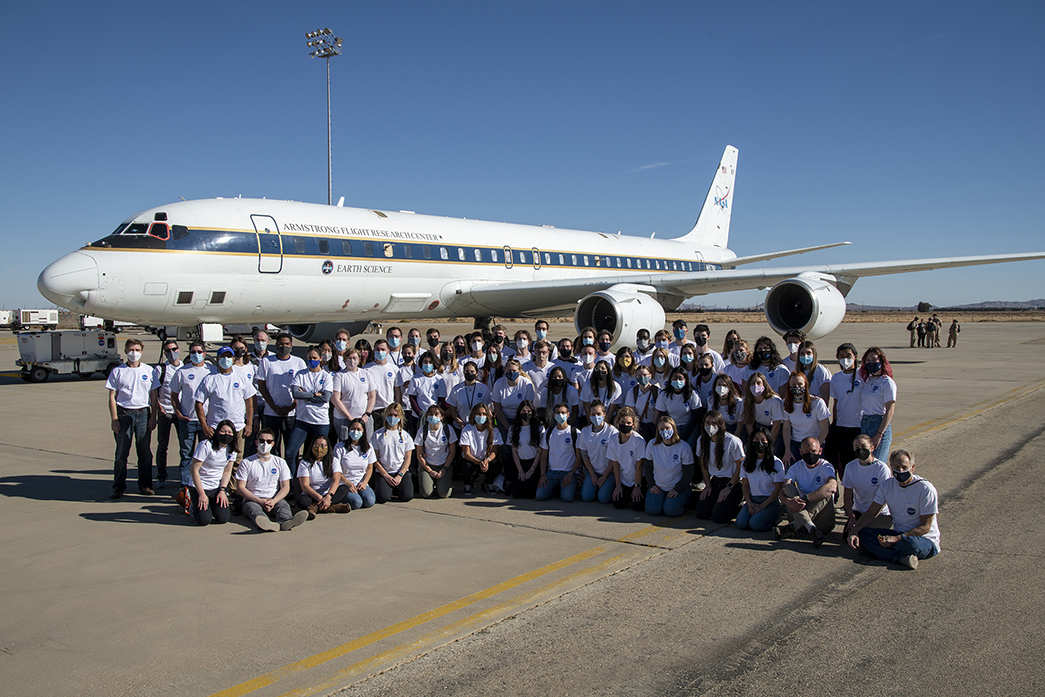 NASA Student Airborne Research Program students, mentors and faculty pose in front of NASA's DC-8 on December 7, 2021 at Armstrong Flight Research ...