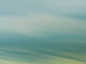 Animated Gif of the X-59 flying over land.