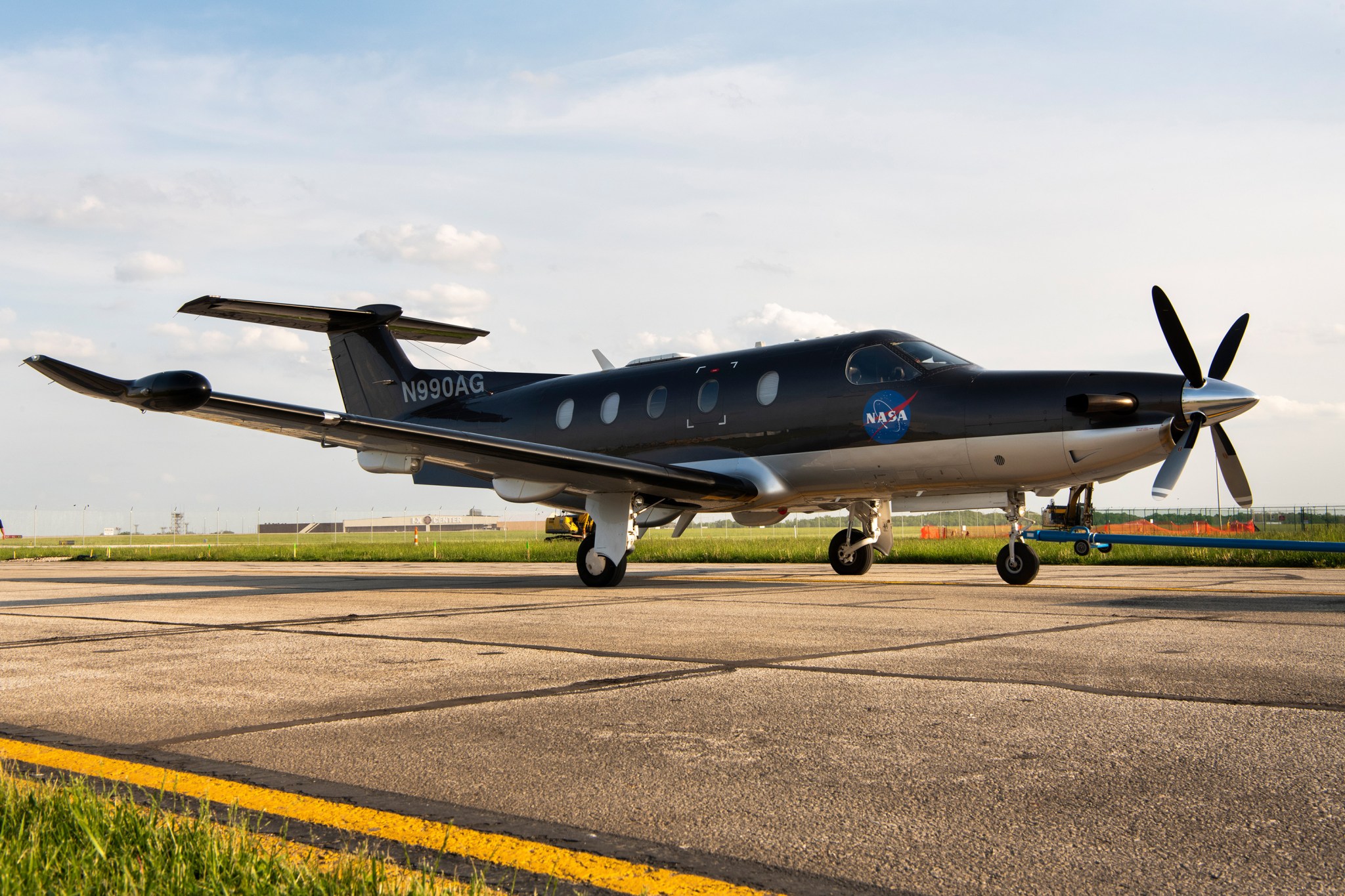 PC-12 Aircraft is seen on the runway outside of NASA Glenn's aircraft hangar.