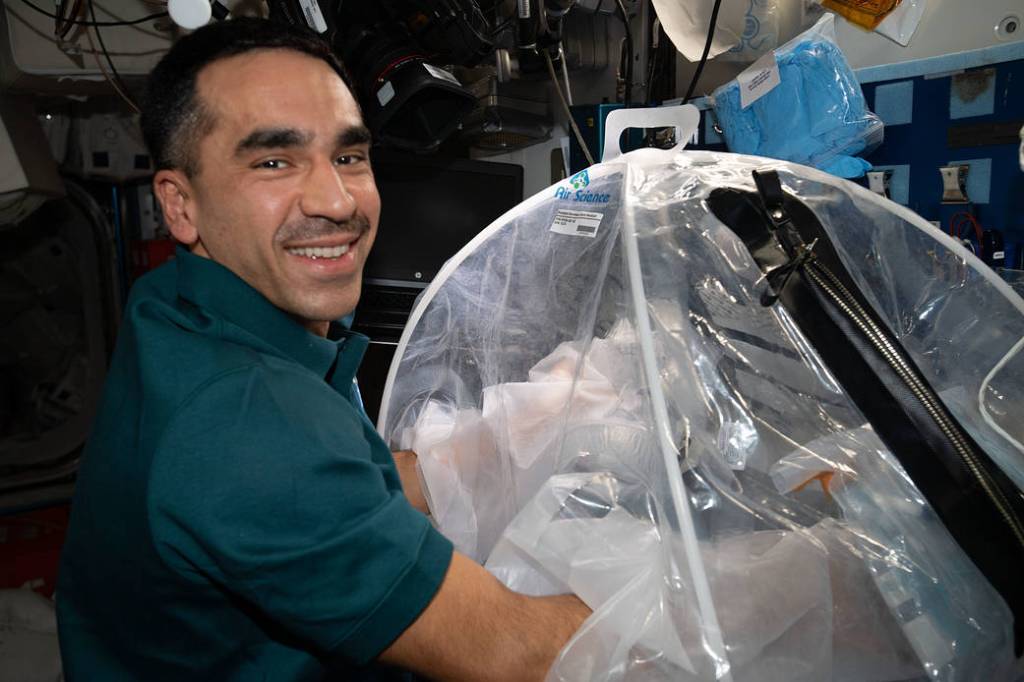 Astronaut Raja Chari works on the Food Physiology experiment