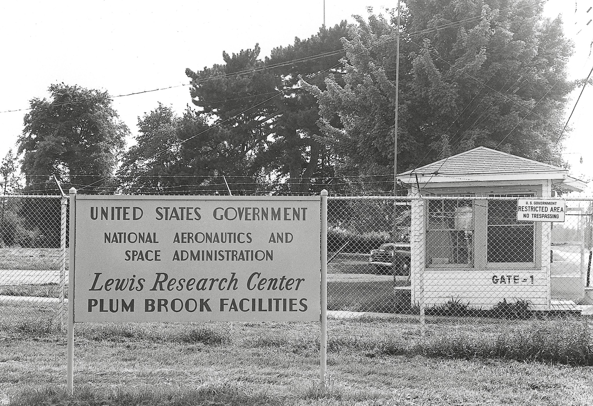 Small guard house along and Plum Brook sign.