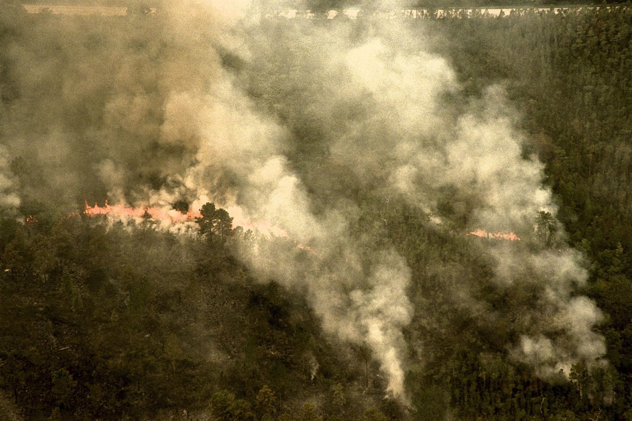 Aerial view of the 1998 Fire with billowing smoke